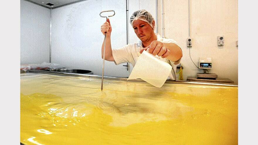 Cheesemaker Lindsay Duncan works on a fresh batch of feta.