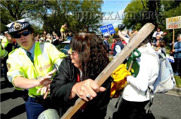 Police move in on a protester at Beaconsfield. Picture GEOFF ROBSON.