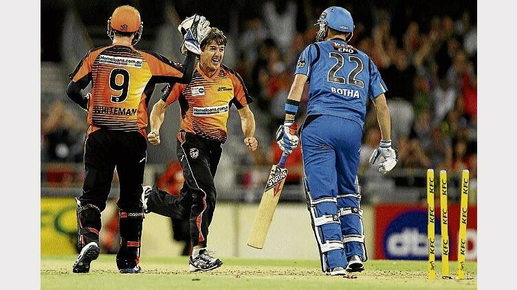 Veteran spinner Brad Hogg celebrates after taking the wicket of Adelaide Strikers batsman Johan Botha at the WACA last night. Picture: GETTY IMAGES