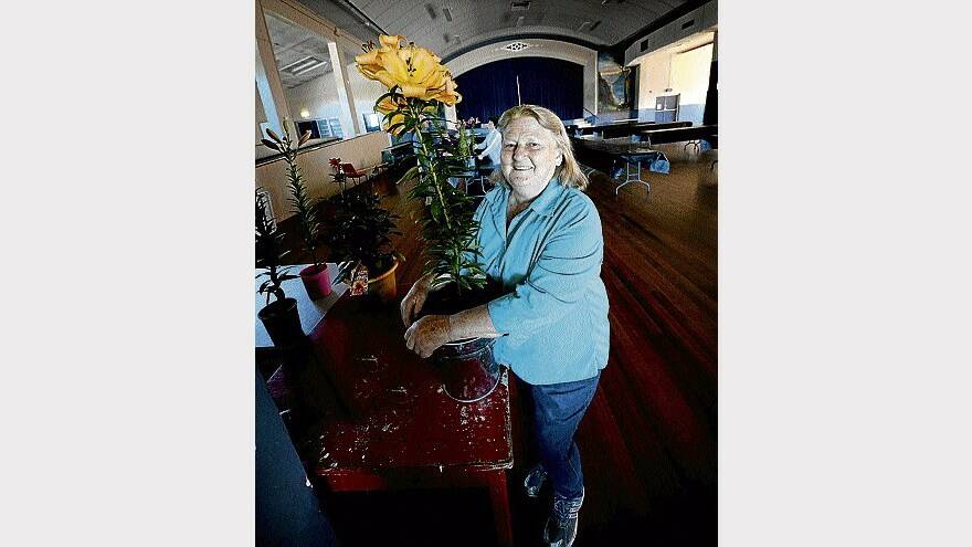 Northern Tasmanian Lilium Society president Vera Masciantonio gets ready for the show this weekend. Picture: GEOFF ROBSON