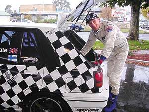 CHEQUERED FLAG BECKONS: Nick Geitel, of Melbourne, checks the spare in his Nissan Pulsar Sports. (1/5)