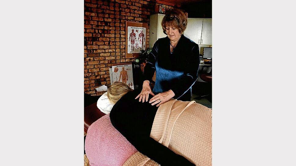 Barbara Gilbery, of Spreyton, applies bowen therapy to a client. Picture: GEOFF ROBSON