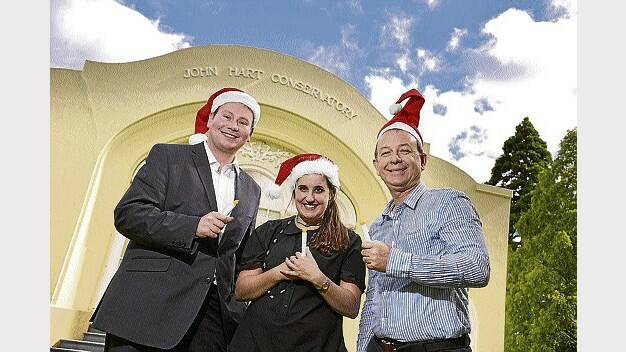 Carols by Candlelight co-ordinator Danny Gibson, Georgina Todman and Vos Family Office chief executive David Gray. Picture: SCOTT GELSTON