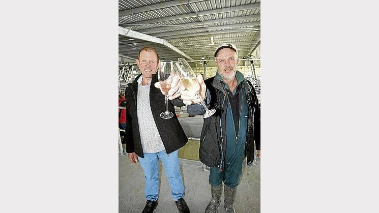 Agrilac directors Roger Bignall and John Blair toast the launch of the company's dairy conversion at Waterhouse, in the North-East. Picture: Peter Sanders