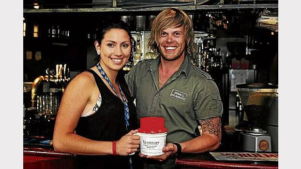 The Star Bar's Chloe Skipper and Sam Waters rattle the tin for The Examiner's Empty Stocking Appeal.  Picture: PHILLIP BIGGS