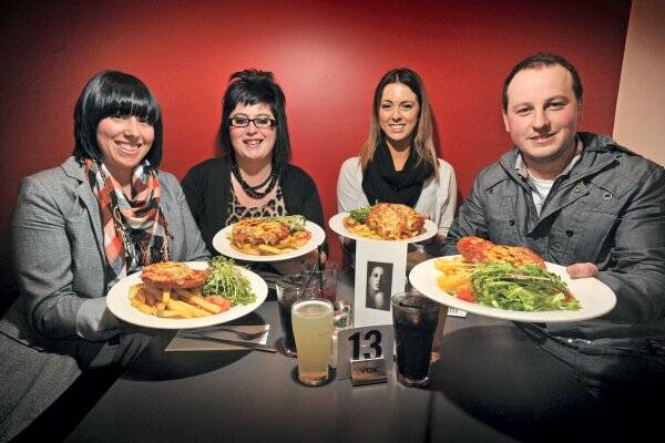  Launceston parmi lovers Lauren Haskell, Jakii Joyce, Gabriella Del Grande and Mitch Duhig sit down to sample their favoured cuisine at O'Keefe's.  Picture: SCOTT GELSTON
