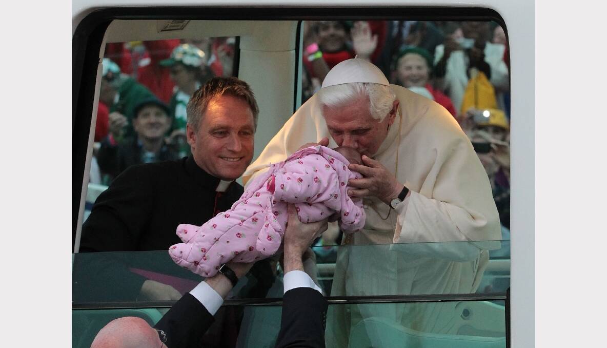 Pope Benedict XVI kisses a baby as he arrives in Hyde Park on September 18, 2010 in London, England. Photo: GETTY IMAGES