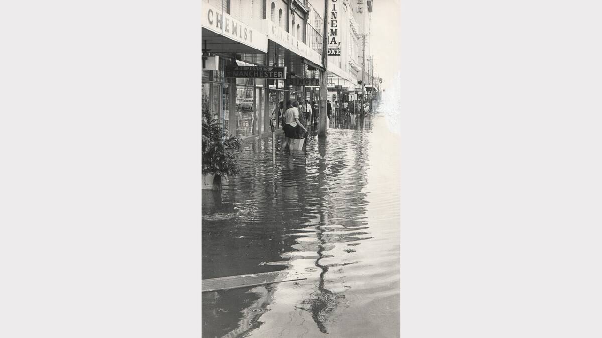A sudden downpour caused flooring in St John Street, opposite the Quadrant Mall. January 28, 1971.