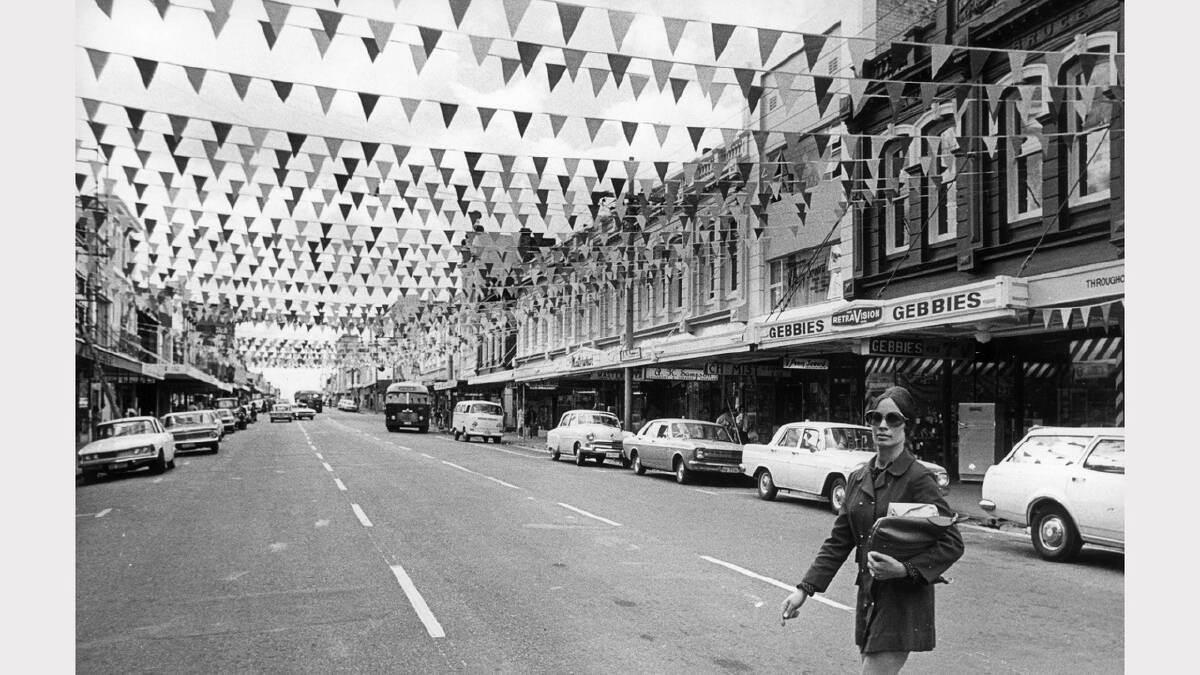 Mrs. R Yates, of Launceston, strolls down Charles Street, which was one of the city's new 'colourways'. December 7, 1971.