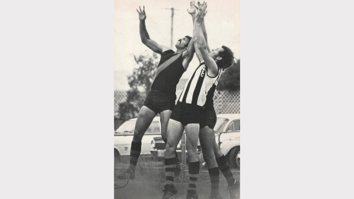 North Launceston's Neil Maynard contests a mark with Devonport captain Chris Hutchins in a practice match at Youngtown, 1975.