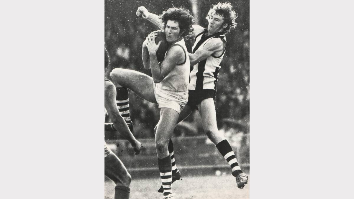 City-South's Mark Fisher marks in front of Scottsdale's Neville Haberman in the second semi-final of 1974 at York Park.