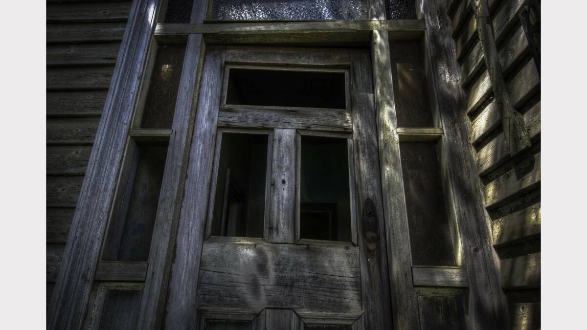 An amazing decaying door of a 1915 house beyond repair.Picture: Urbex Photography.