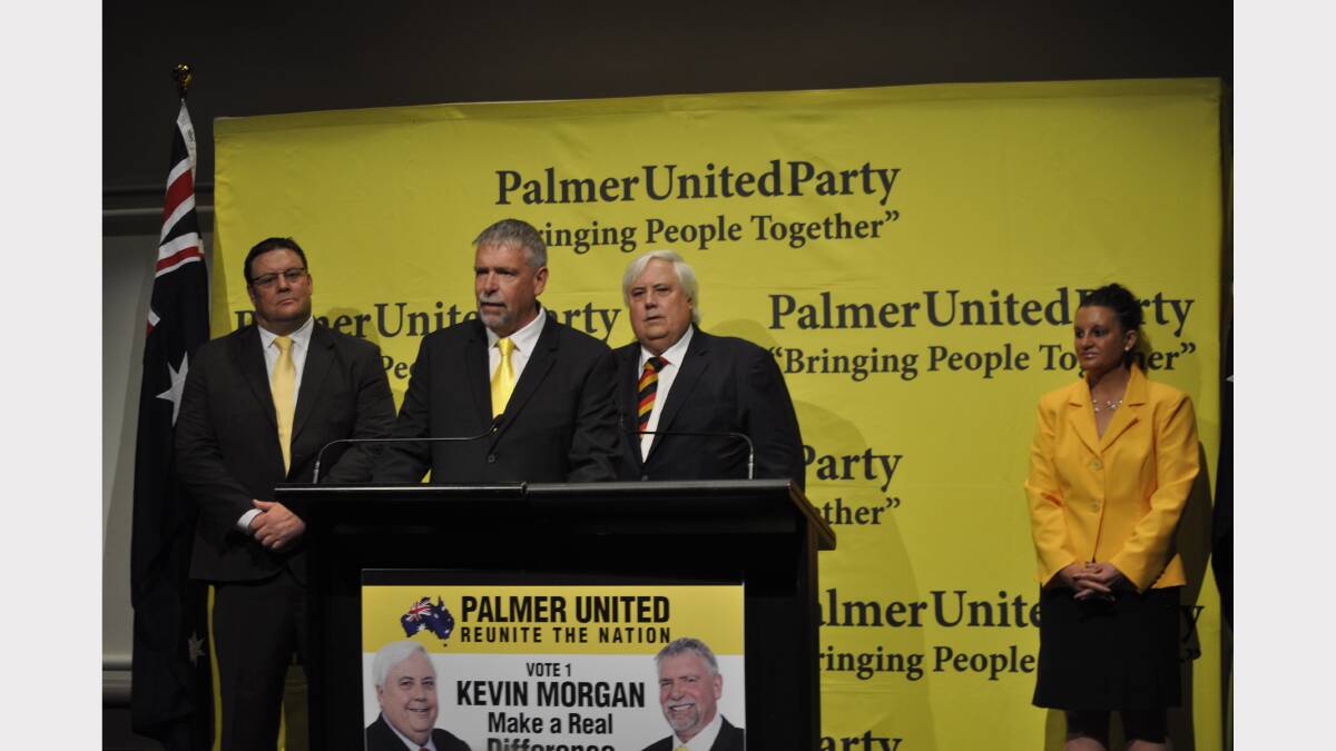 Kevin Morgan addresses media and PUP supporters after being announced as the PUP candidate for Premier. Party Leader Clive Palmer, Senator-elect Jacqui Lambie and Senator-elect Glenn Lazarus look on.
