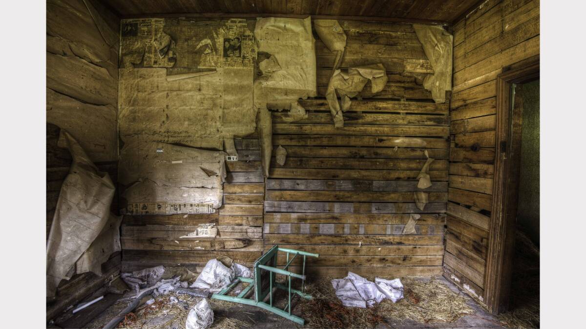 Interesting newspaper wall covers inside an old farm house that housed 11 children. Picture: Urbex Photography.