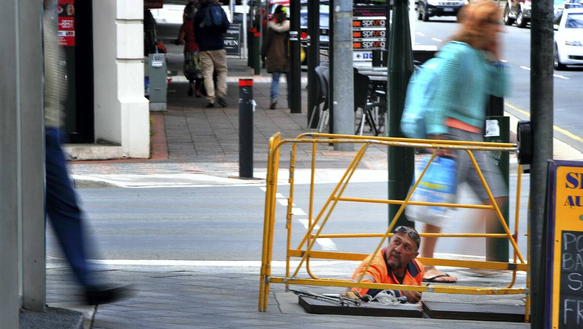 Contractors roll out NBN cables in York Street, Launceston.  Picture: SCOTT GELSTON