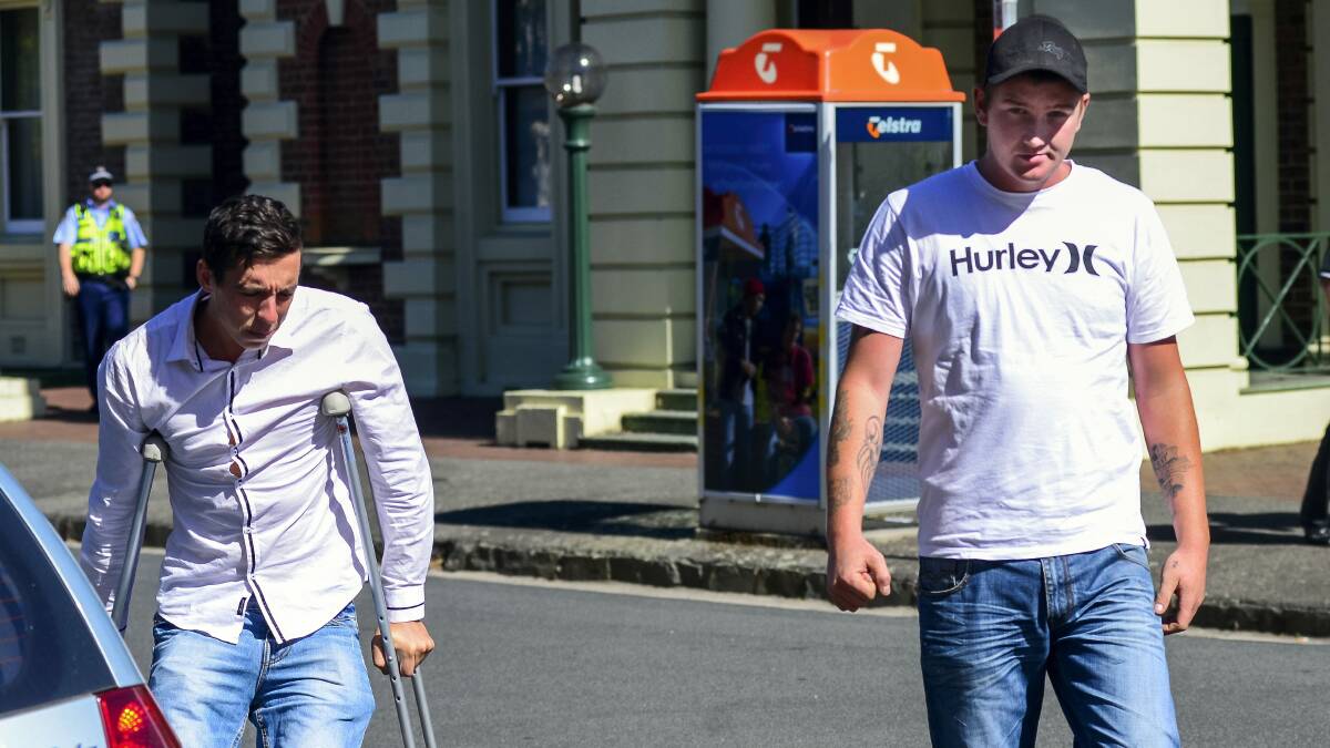 Jack Clarence Bielski, on crutches  and Trent Terrence Hill leave the Supreme Court in Launceston. Picture: PHILLIP BIGGS