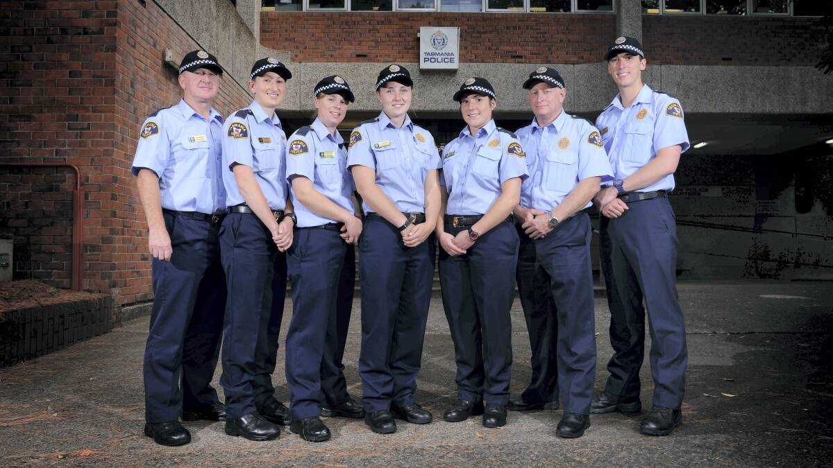 New constables Michael Grenda, Brooke Lynch, Charley Freeman-Finn, Evelyn Steane, Hannah Orchard, Rodney Dance and Jack Fawdry outside the Launceston HQ on their first day of work. Picture: SCOTT GELSTON