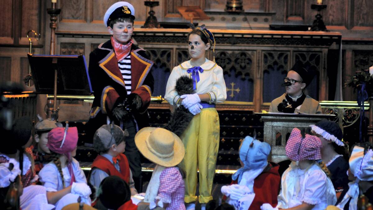 om Wood, 11, as Captain Cat, Imogen Duigan, 9, as Fat Fred, and Eva Lawrence, 10, as Vicar Mole, perform at the Holy Trinity Church. Pictures: GEOFF ROBSON