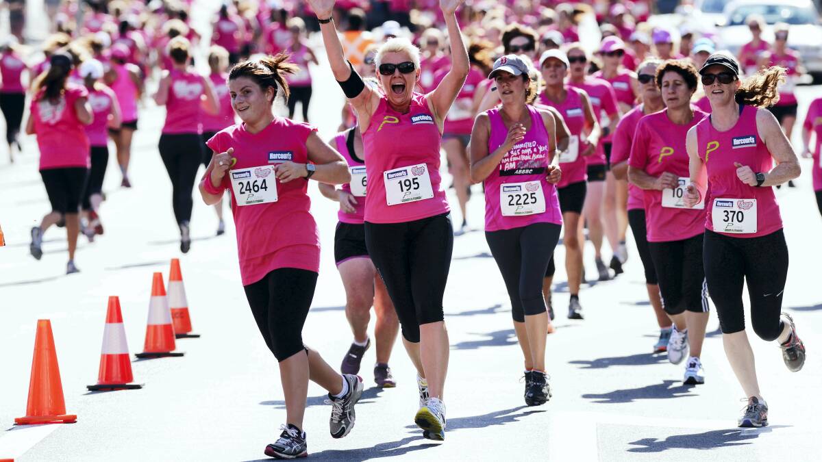 The pink field of the Harcourts Women's 5km Run and Walk streams through Launceston's Civic Square yesterday. Pictures: SCOTT GELSTON