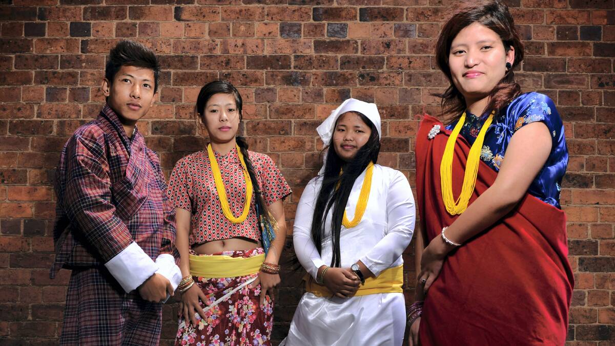 Bikram Rai, Buna Rai, Pasitra Subba and Sita Gurung dress in traditional clothes ahead of the Bhutanese national day celebrations.  Picture: SCOTT GELSTON