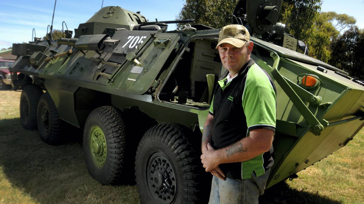 roy Walker, of Tassie Tank Adventures, with Russian military vehicles imported to take people on rides.  Picture: GEOFF ROBSON