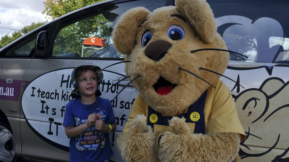 Flynn Maartensz, 4, of East Launceston, with Ditto the Bravehearts mascot in Launceston.