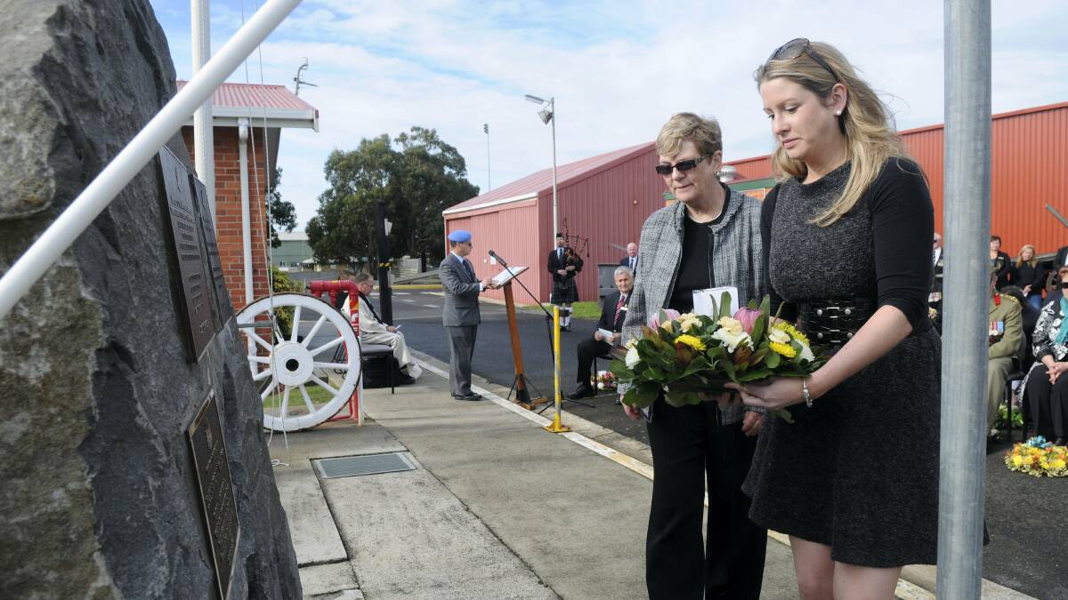 Daughter Sarah and widow Susan McCarthy, of Canberra, with the plaque to honour UN peacekeeper Peter McCarthy, who died in Lebanon 25 years ago.  Picture: PAUL SCAMBLER