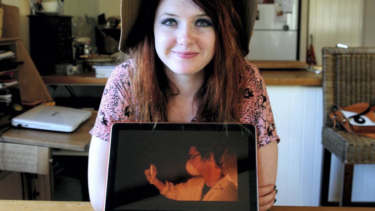 Eloise Thetford with a still image from her film about animal cruelty. Picture: GEOFF ROBSON