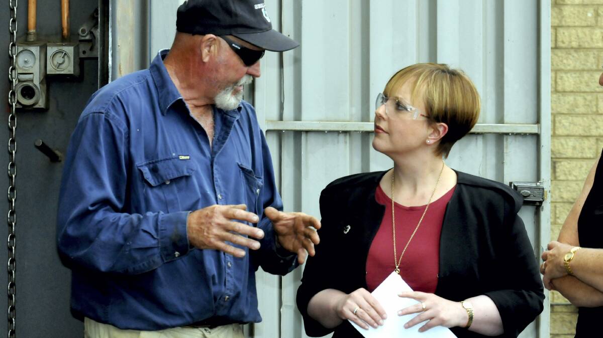 Welding Works owner Boyd Gleeson talking with Premier Lara Giddings yesterday about the state's mining industry.   Picture: NEIL RICHARDSON