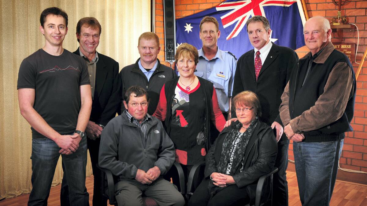 Helicopter crash survivor Kelvin Howe and his wife Margaret, seated, with fellow survivor Pat Frost, centre, and back, from left, ground and air rescue team members Martin Boyle, Graeme Jones, Damian Bidgood, Gerald Van Rongen, Roger Corbin and Lindsay Godfrey.  Picture: PHILLIP BIGGS
