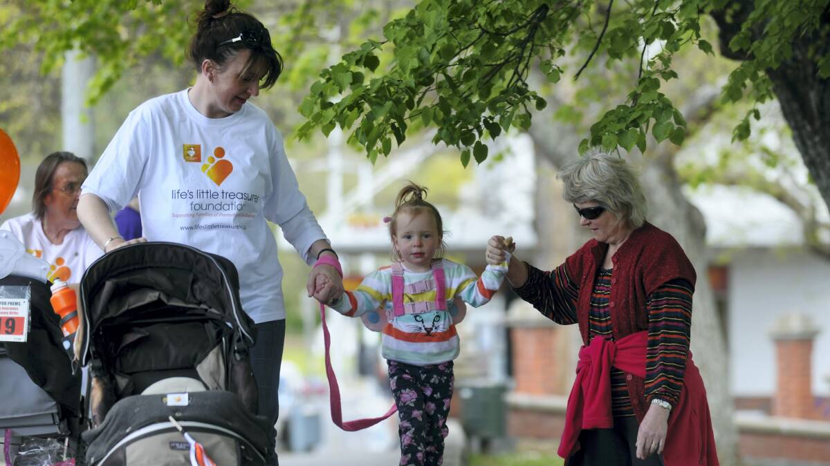Julianne Smith and her daughter, Ada Reeves 2,  of Launceston, are joined by Jenny Mathewson, also of Launceston, during yesterday's Walk for Prems at Royal Park.   Picture: PAUL SCAMBLER