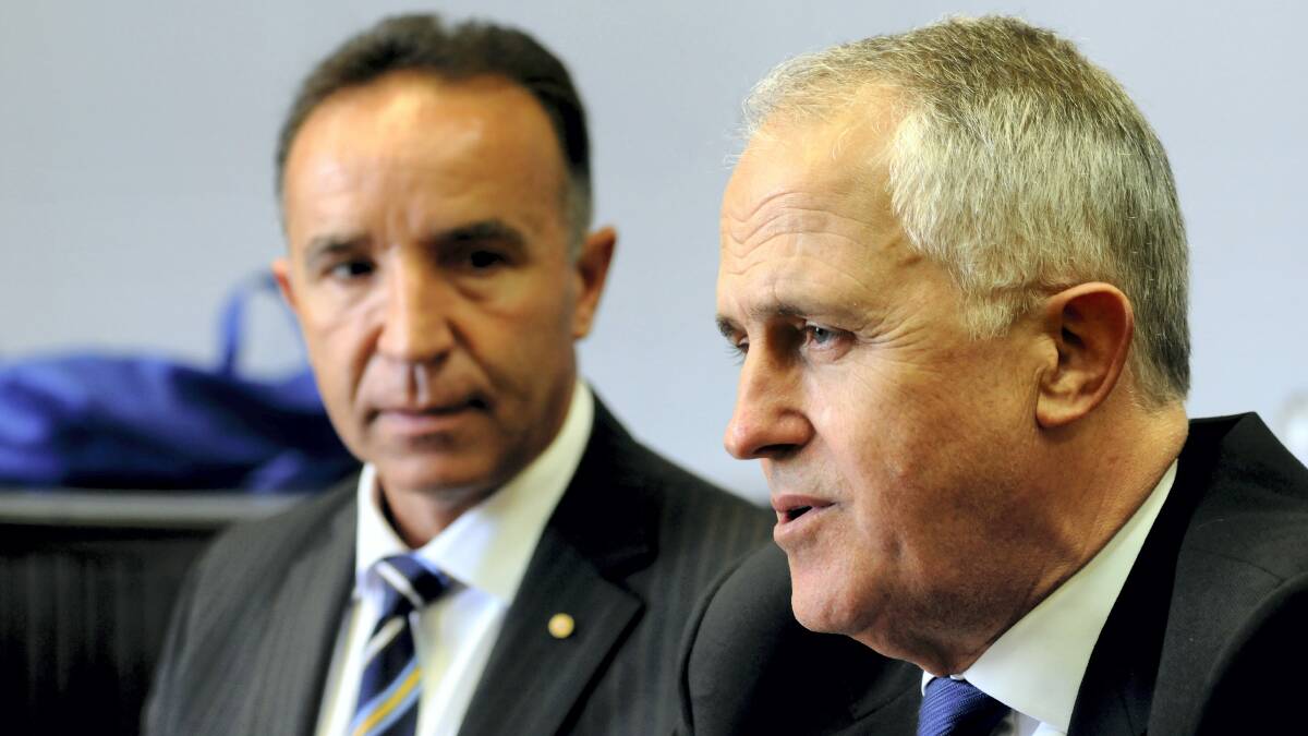 Bass Liberal MHR Andrew Nikolic and Communications Minister Malcolm Turnbull. Mr Nikolic has defended the Coalition's broadband policy.