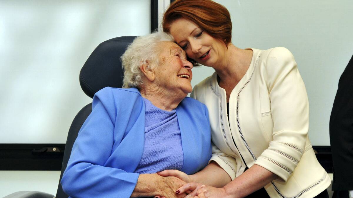 Prime Minister Julia Gillard shares a special moment with Valerie Clark during her visit to Launceston.