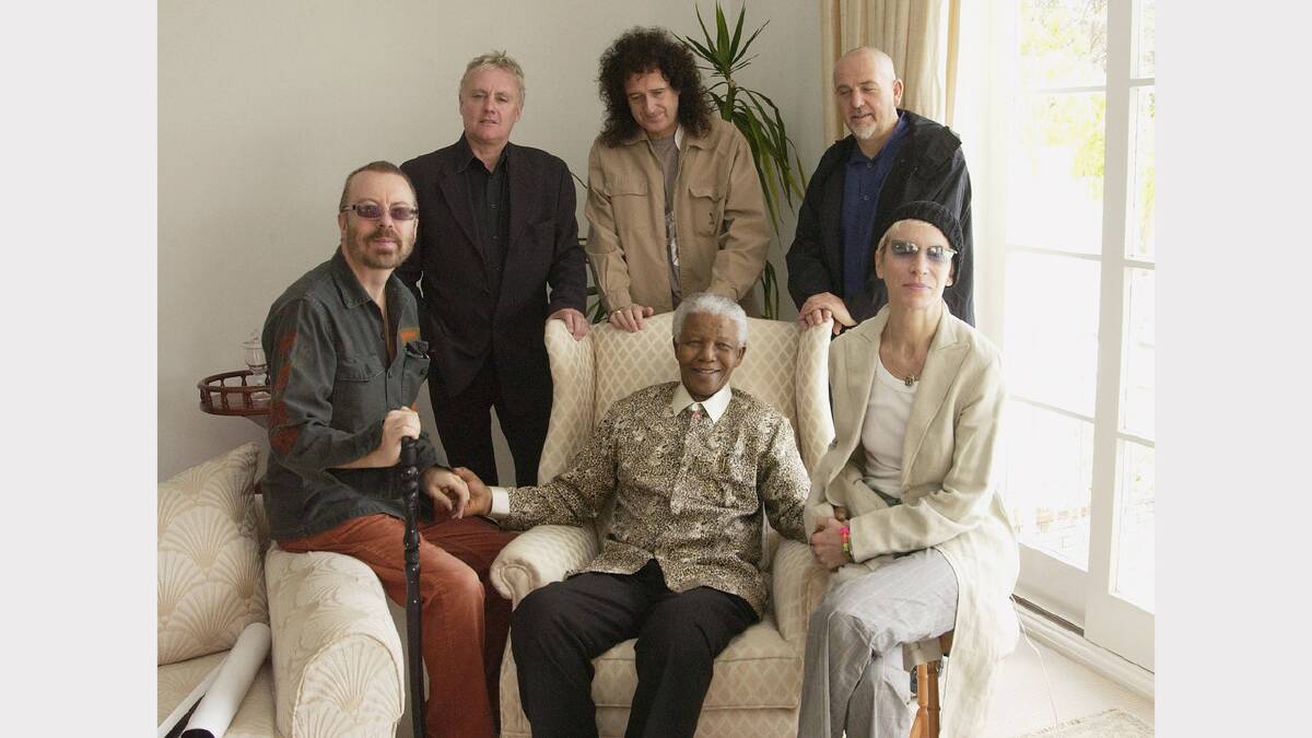 Nelson Mandela with artists (from left to right) Dave Stewart, Roger Taylor, Brian May, Peter Gabriel, and Annie Lennox photographed at Nelson Mandela's house prior to the 46664 concert in Cape Town, South Africa, on 27 November, 2003. 