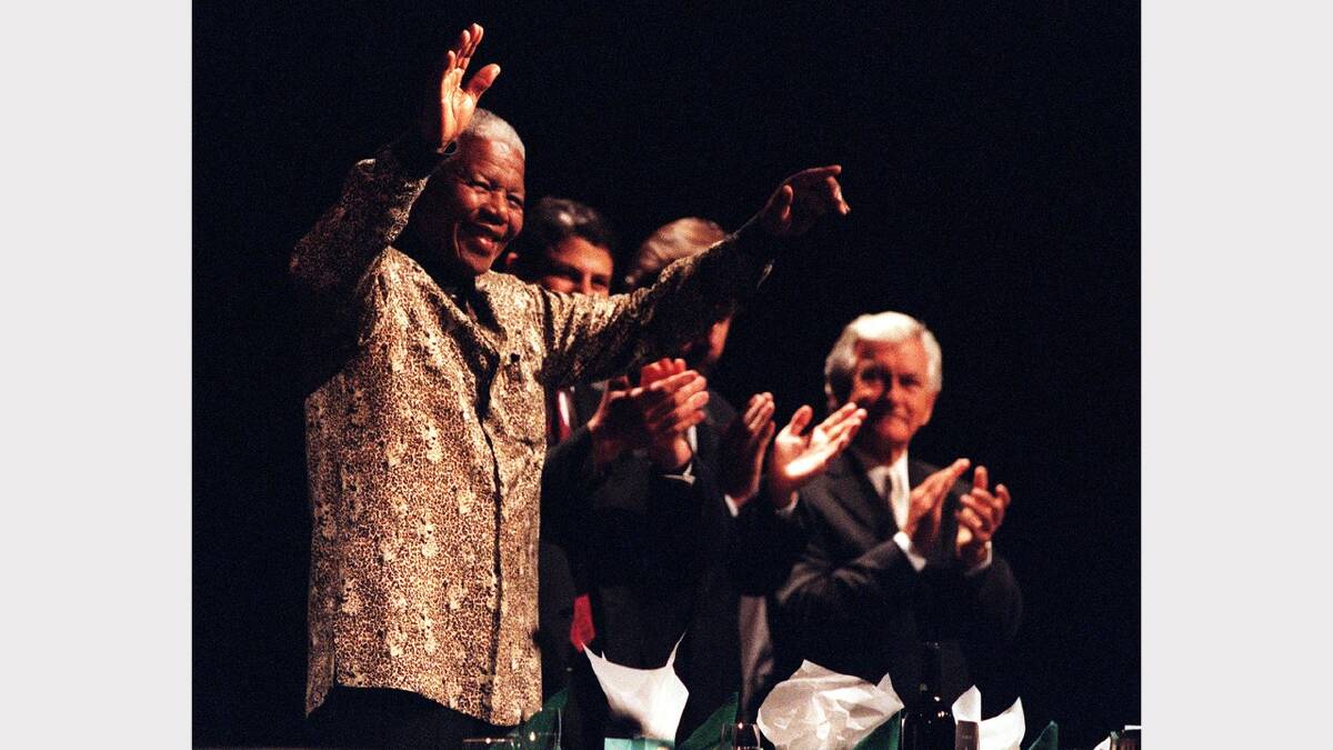 Nelson Mandela is welcomed to the Nelson Mandela Tribute Luncheon for World Reconciliation Day September 8, 2000 at the Melbourne Exhibition Centre, in Melbourne, Australia. (Photo by Hamish Blair/Liaison)	