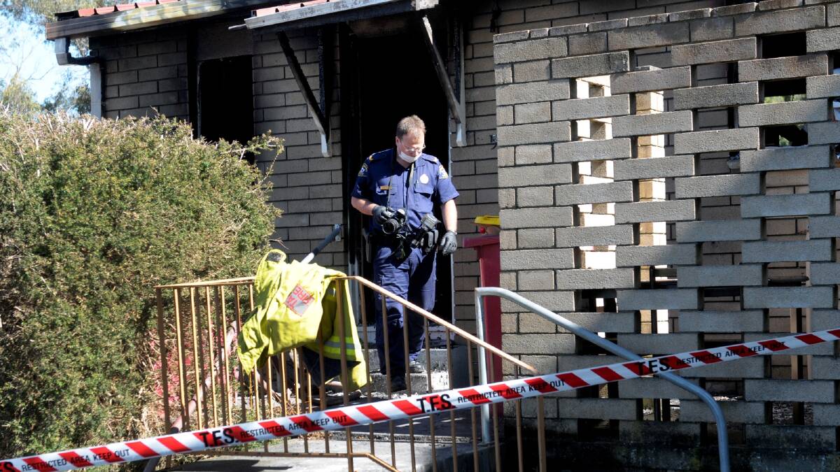 Senior Constable Rodney Walker, of Tasmania Police forensics, at the scene of this morning's unit fire in Pioneer Parade in Ravenswood. Photo: Geoff Robson