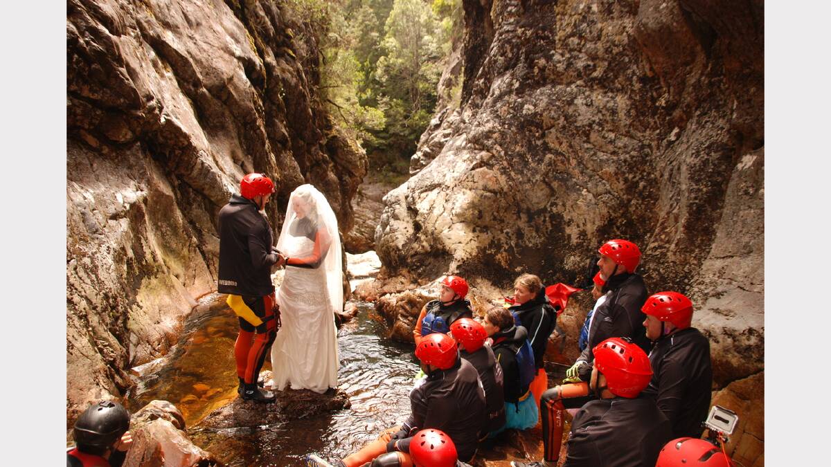 Jarrod Wells and Cassy Austin exchange vows ... then take the plunge, so to speak. Photo courtesy Cradle Mountain Canyons. 