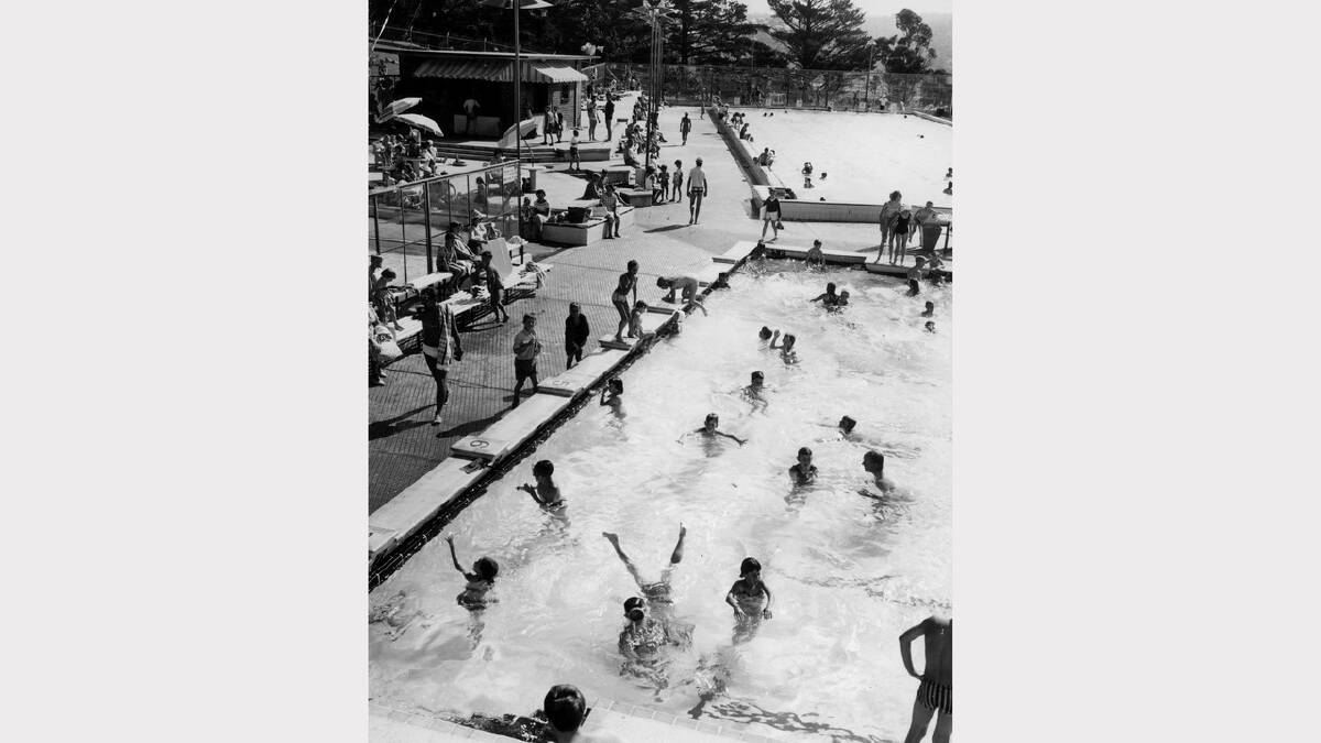 Swimmers revel in the hot weather at the City Baths. Photo: January 1966.