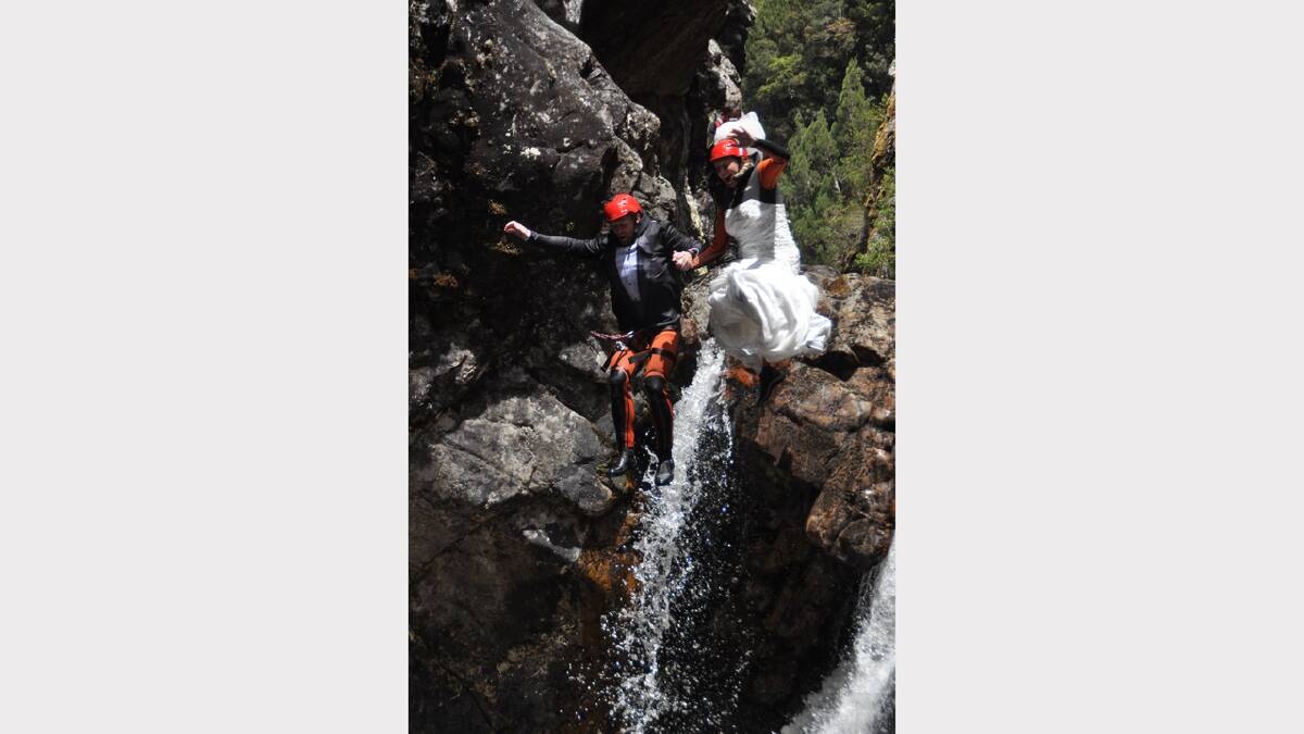 Jarrod Wells and Cassy Austin exchange vows ... then take the plunge, so to speak. Photo courtesy Cradle Mountain Canyons. 