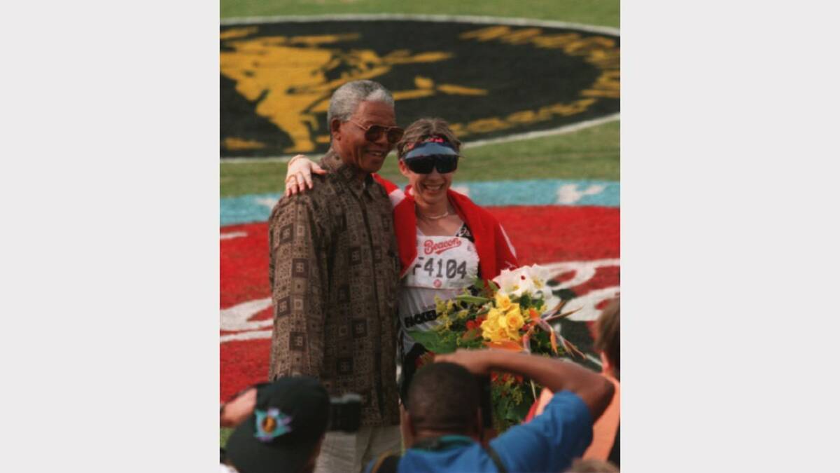 20 MAY 1995:  The Womens winner Maria Bak of Germany with South African president Nelson Mandela after the Comrades Marathon in Durban, South Africa.