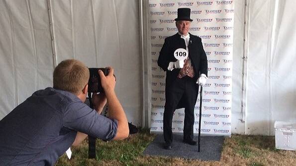 The Examiner photographer Mark Jesser lines up an entrant in the Fashions on the Field.