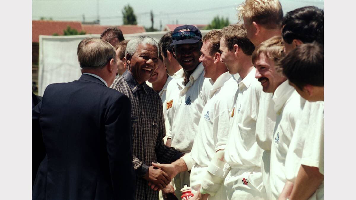  Nelson Mandela shakes the hand of Alec Stewart of England before the Tour Match between South Africa Invitation XI and England held on October 27, 1995 at the Elkah Oval, in Soweto, South Africa. 