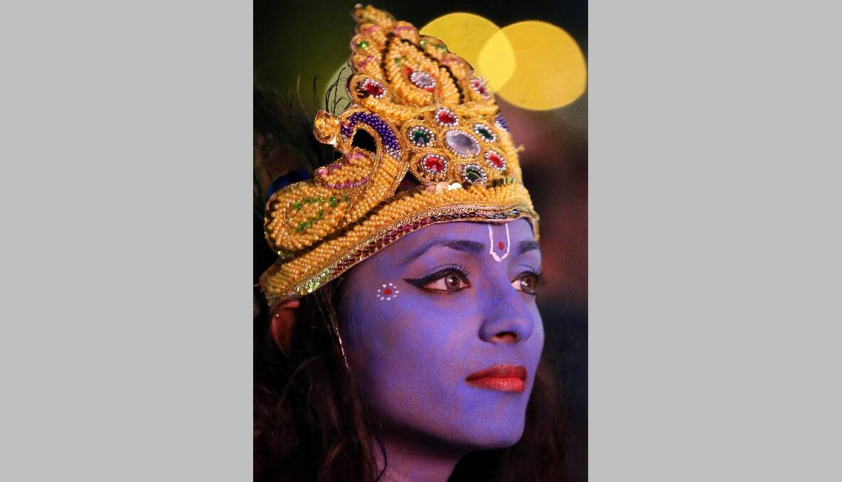 Dancer Vimi Solanki waits to perform on stage as Lord Krishna during the Hindu festival of Diwali on November 13, 2012 in Leicester, United Kingdom. Photo by Christopher Furlong/Getty Images