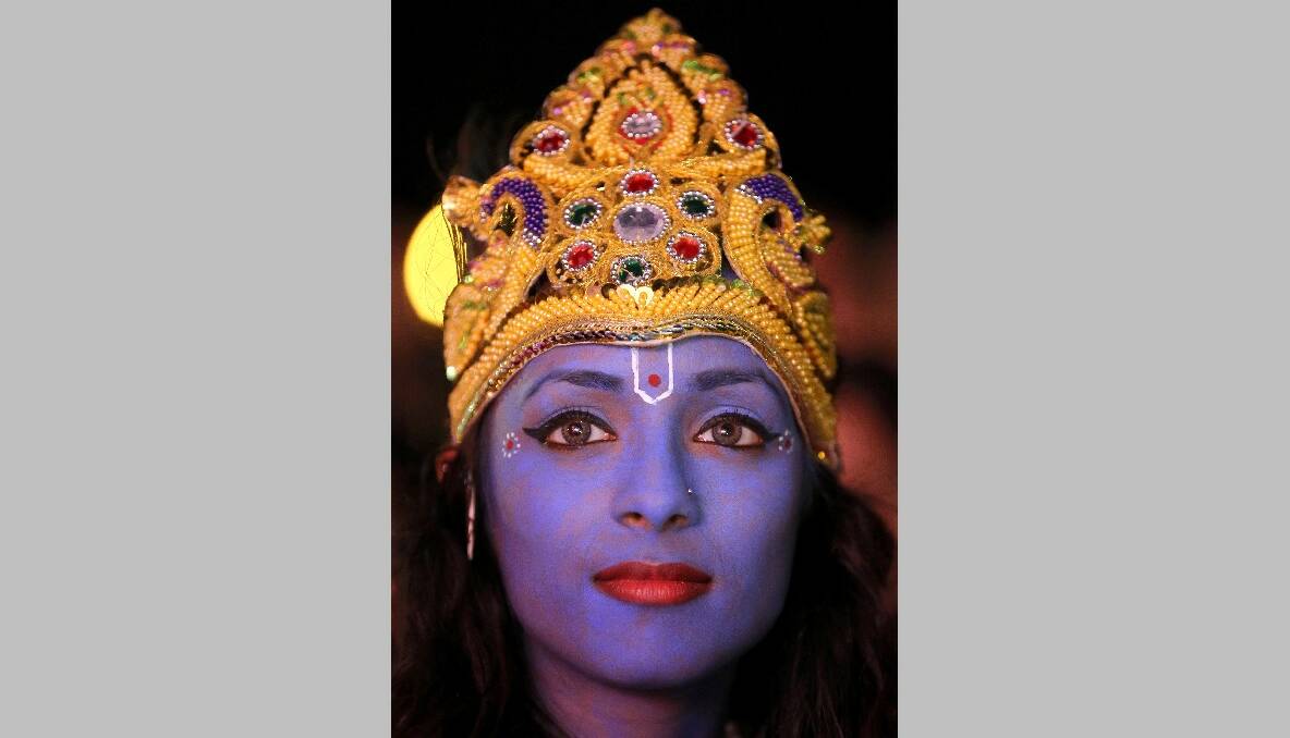 Dancer Vimi Solanki waits to perform on stage as Lord Krishna during the Hindu festival of Diwali on November 13, 2012 in Leicester, United Kingdom. Photo by Christopher Furlong/Getty Images