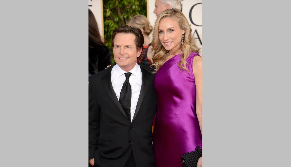 Actor Michael J. Fox and actress Tracy Pollan arrive at the 70th Annual Golden Globe Awards. Photo by Jason Merritt/Getty Images