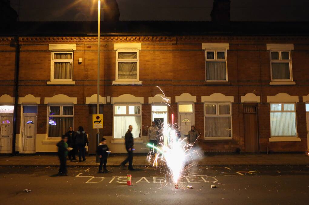 Locals light fireworks in the street during the Hindu festival of Diwali on November 13, 2012 in Leicester, United Kingdom. Photo by Christopher Furlong/Getty Images
