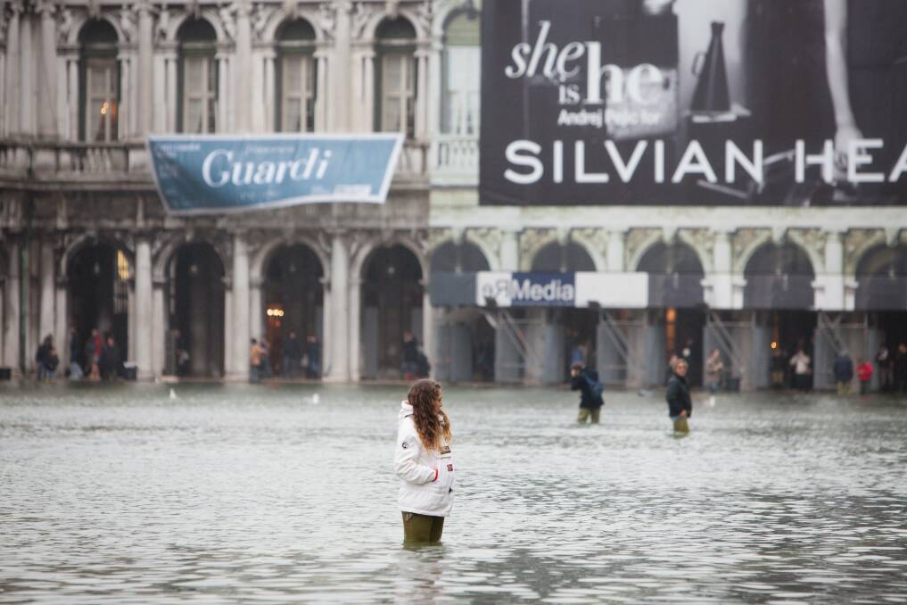 The Italian town Venice is flooded, after an exceptionally strong flood wave hits the city and increases the water level to 1.4metres in Venice, Italy. 60 percent of Venice was flooded, affecting homes and shops. Photo: Arved Gintenreiter