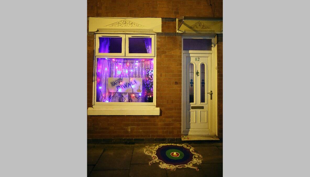 A house is decorated to celebrate the Hindu festival of Diwali on November 13, 2012 in Leicester, United Kingdom. Photo by Christopher Furlong/Getty Images