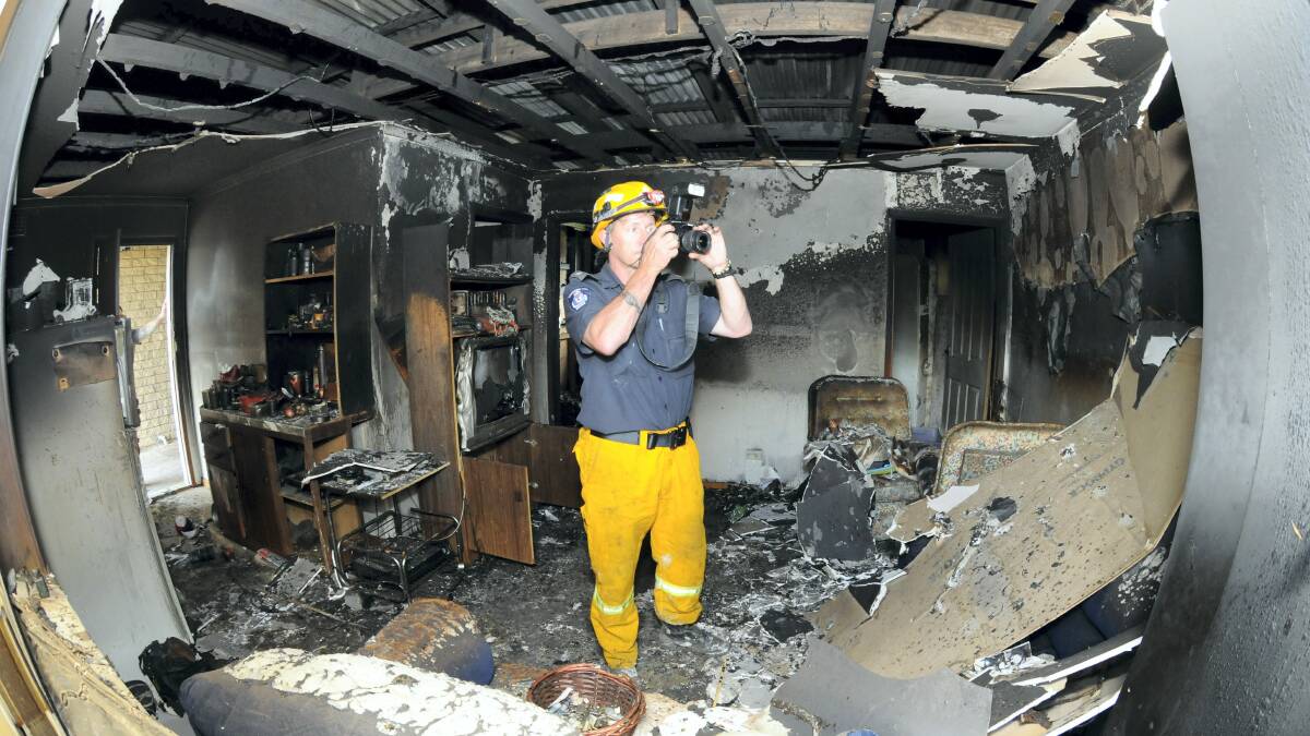 Tasmanian Fire Service investigation officer Dale Lapham, of the Launceston brigade, at the scene of Sunday's fire at George Town.  Picture: PAUL SCAMBLER