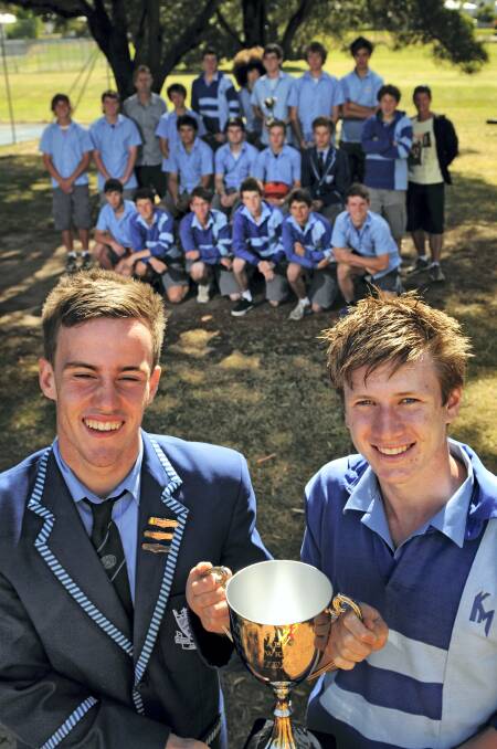 Kings Meadows High School football team co-captains Jordan Bennett and Ben Murfett in front of the team going to Melbourne tomorrow - William Fisher, Ethan Goldfinch, James Kerr, Damien Bell, John Cario, Tyron Richards, Aaron Dakin, Sean Walsh, Wade Lello, Lachlan Wheatley, Jacob McKinnon, Mitchell Collins, Connor Williams, Nick Bennett, Kailem Baker, Bradley Murdock, Jack Dyer, Nathan Jackson, Aidan Collins, Andrew Rigby, Brice Simpson and Brayden Worker.   Picture: PHILLIP BIGGS